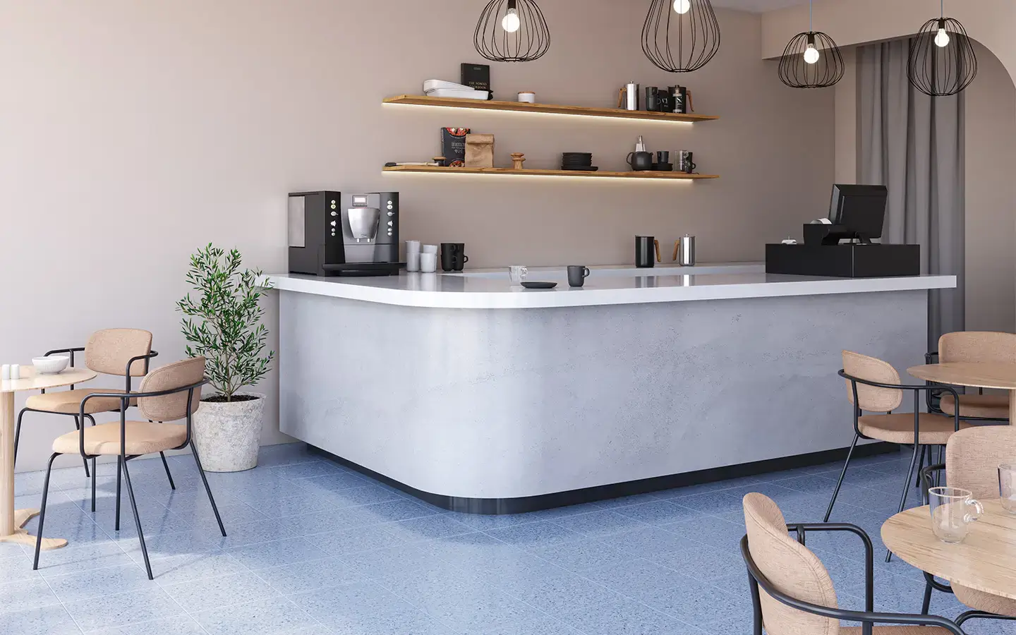 Espacio de cafetería moderno con barra blanca y piso en cerámica azul tipo terrazo, ejemplo de diseño interior funcional y sostenible